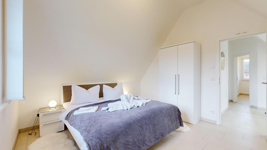 Ferienhaussiedlung nahe Stralsund und Rügen - Schlafzimmer mit Doppelbett